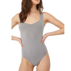 Free People bodysuit nice gray color double lined at bra area. Versatile sexy.